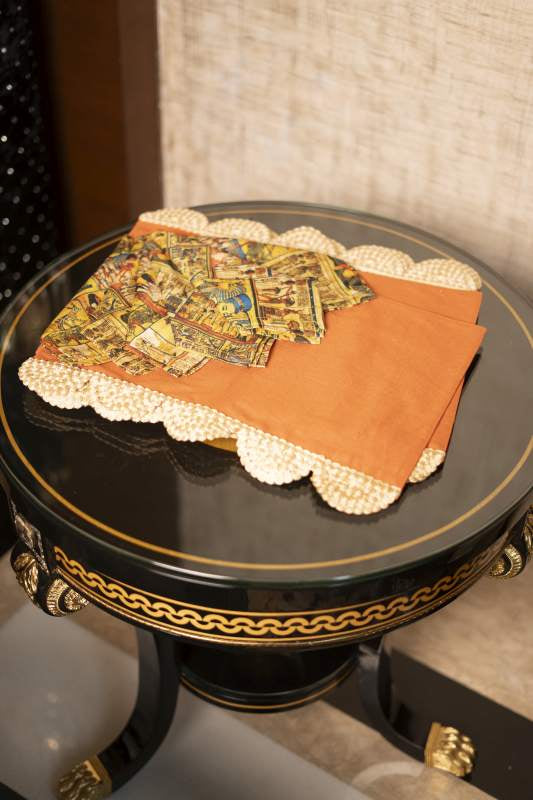 Orange Mats with Mesopotaniam Napkins